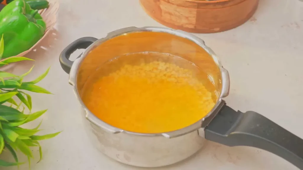 Boiling chana dal.