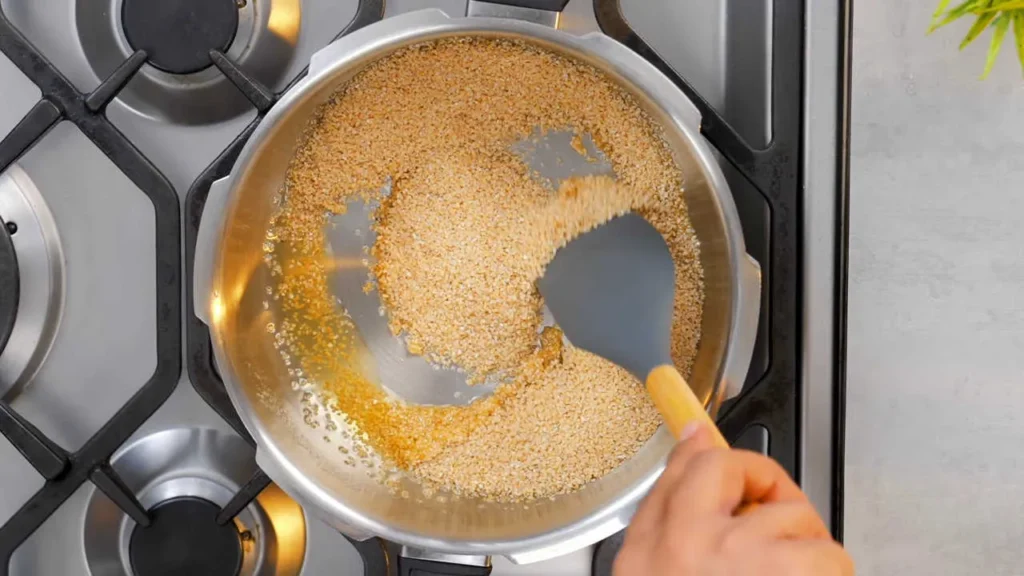 Roasting broken wheat (Daliya)