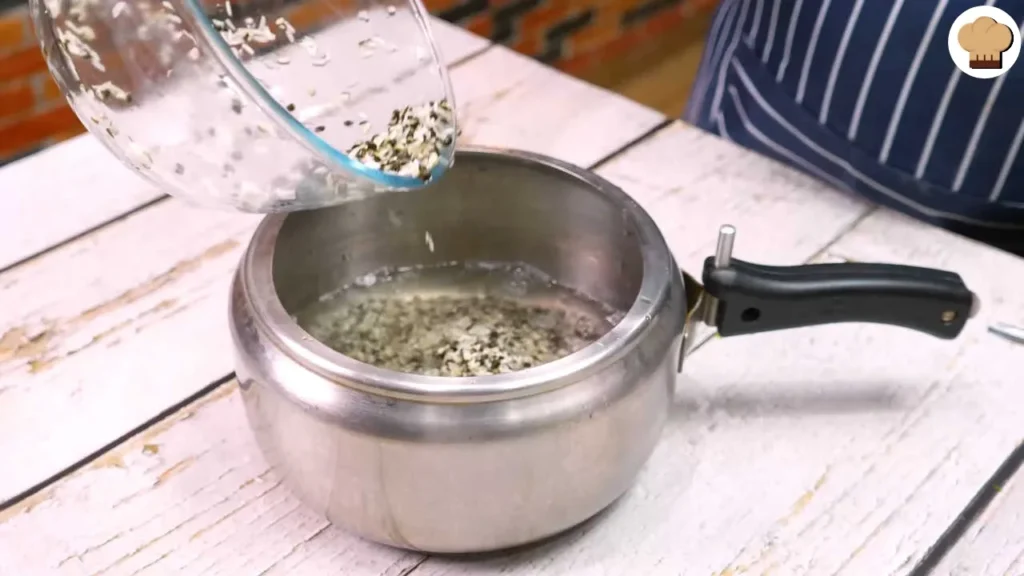 Preparing for cooking Rice and Urad Dal in pressure cooker 