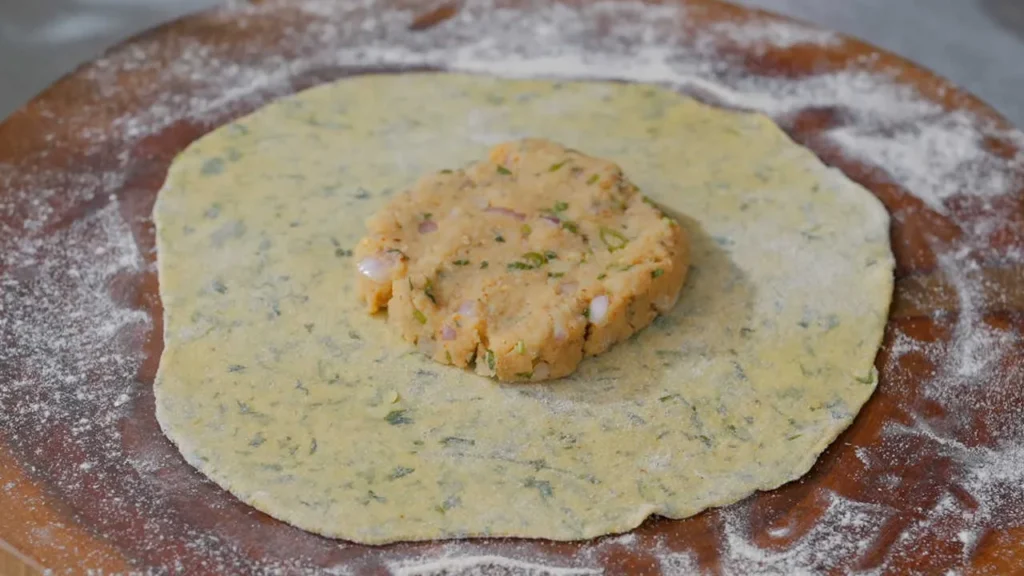 potato stuffing in the center of the rolled dough 
