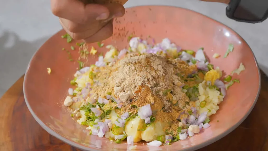 Adding Spices in Aloo Stuffing