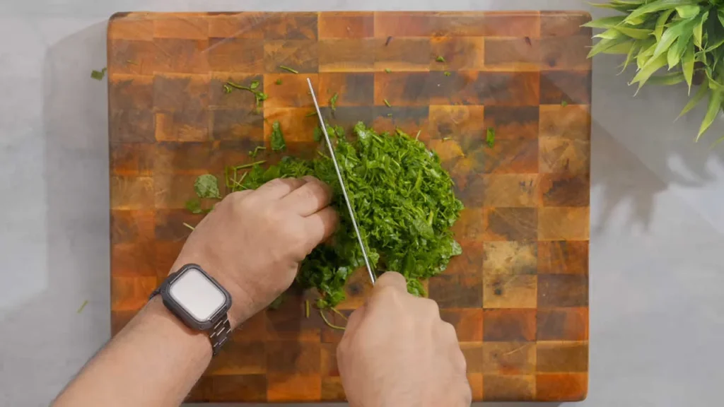 Finely Chopping Methi (Fenugreek)
